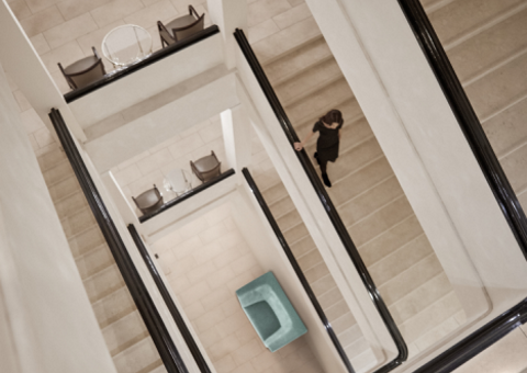 A woman walking down the stairway