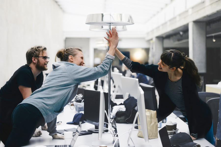 Two women high-fiveing