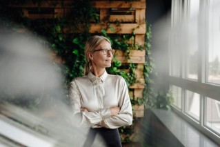 Corporate Social Responsibility, a woman is looking out the window