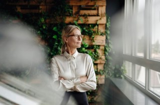 Corporate Social Responsibility, a woman is looking out the window