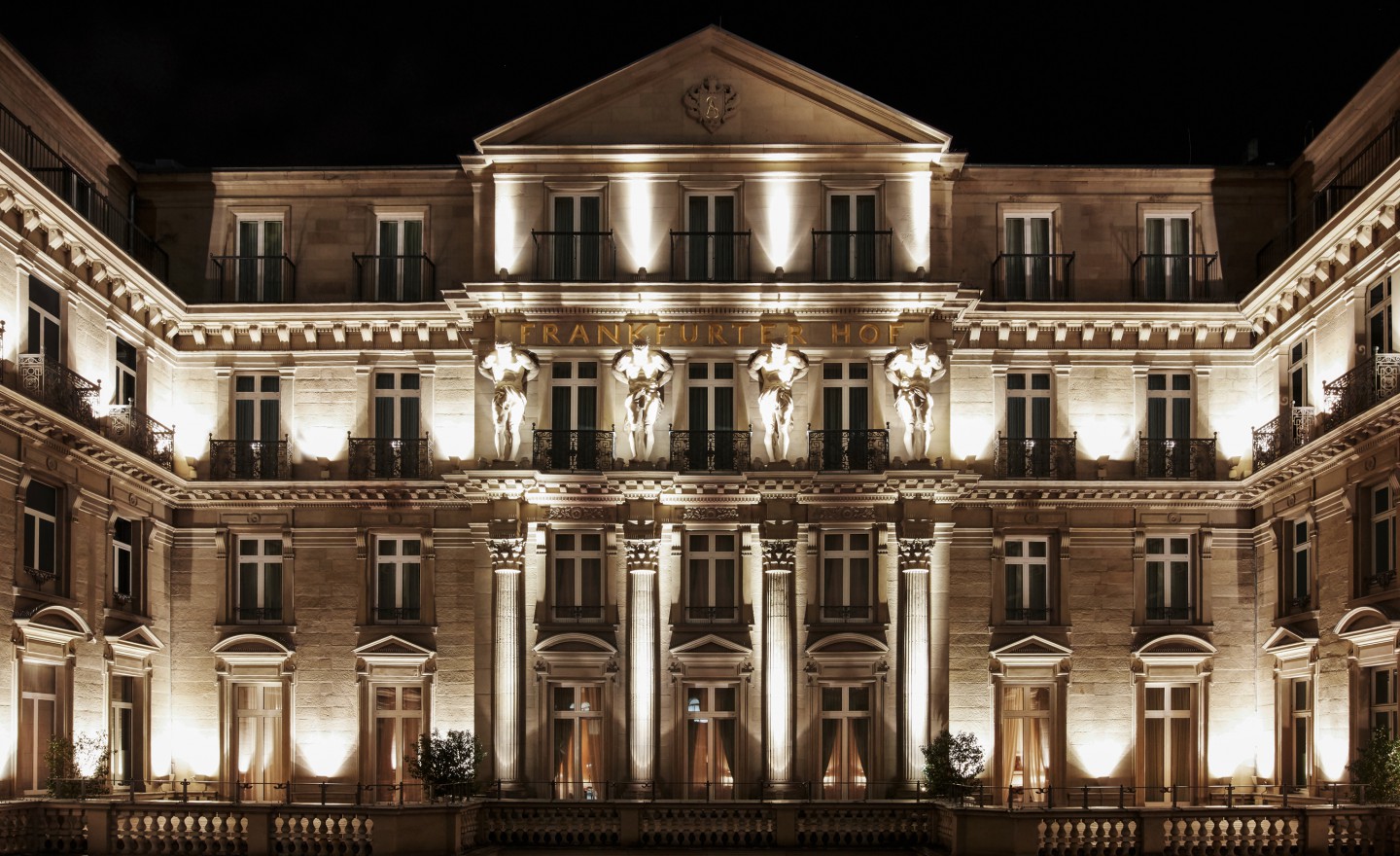 Nighttime illumination of a Steigenberger Icons hotel front