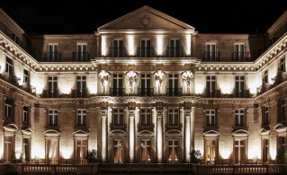 Nighttime illumination of a Steigenberger Icons hotel front