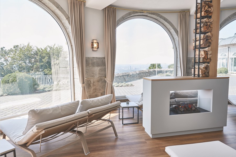 View of the gardens through a stunning arched window front