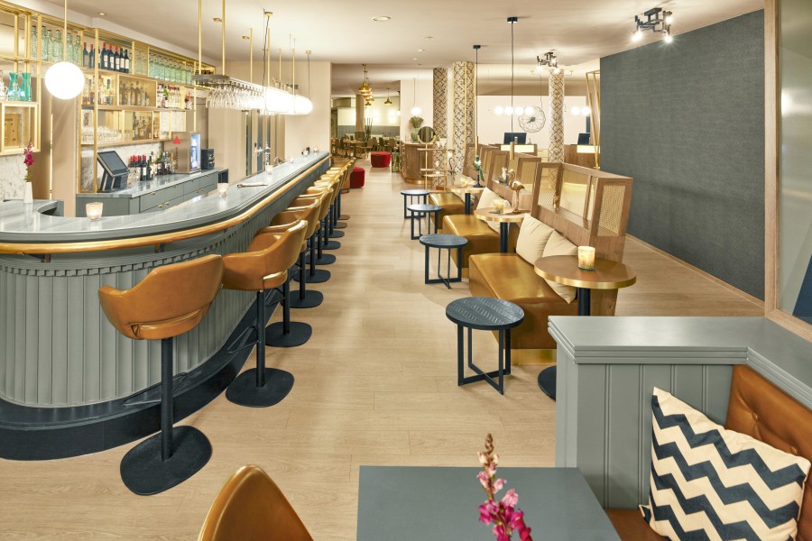 Bright hotel bar with coffee shop flair at MAXX Hotels