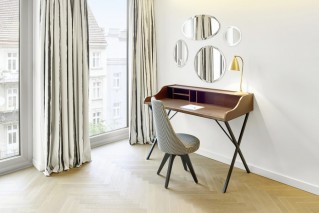 Work area with desk and natural lighting at MAXX Hotels