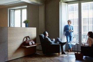 A group of people in a spacious lounge area.